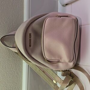 Micheal kors light pink backpack/crossbody bag